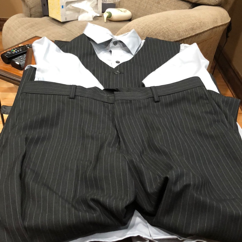 Calvin Klein button down shirt, vest, and pants